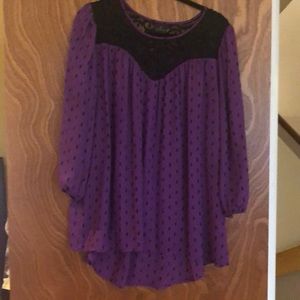 Purple and black dot shirt.